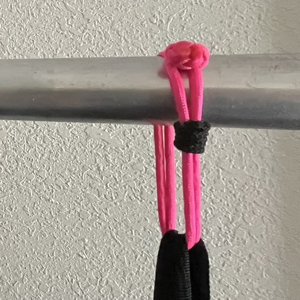 A closeup of my flawed whip knot on a pink soft shackle.