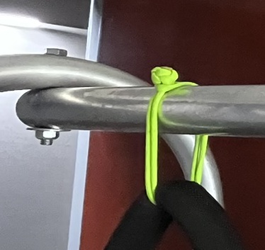 This is another shackle that is not secured by anything but the downward tension of the backpack and the placement of the stopper knot on the top of the bar.